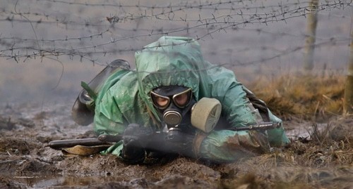 Военнослужащий в костюме  радиохимической и биологической защиты. Фото: пресс-служба Минобороны РФ,https://www.mil.ru